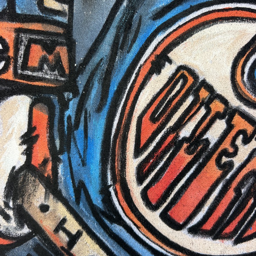 Macro detail of the hand-lettered Edmonton Oilers crest